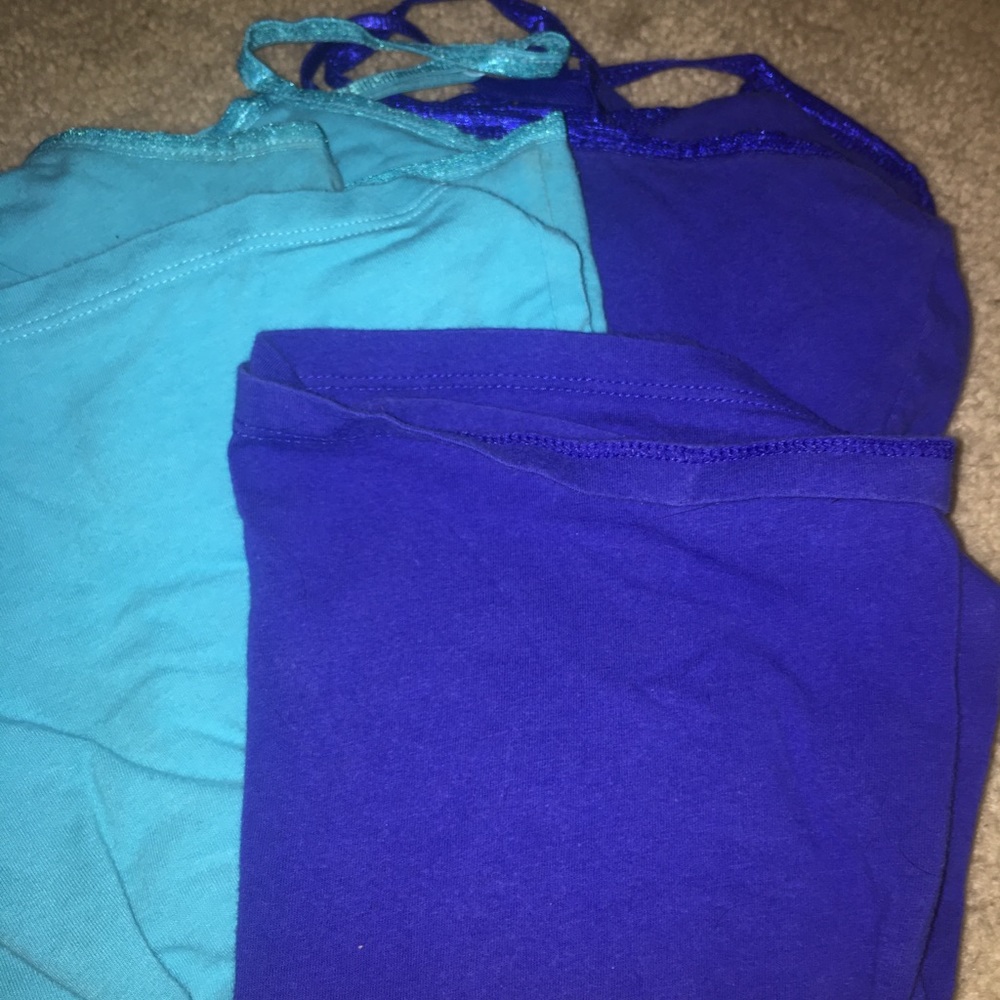 3 different colored tank tops